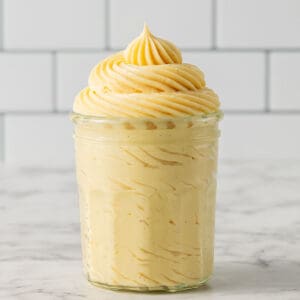 Close up thumbnail image of vanilla custard pudding sitting in a glass