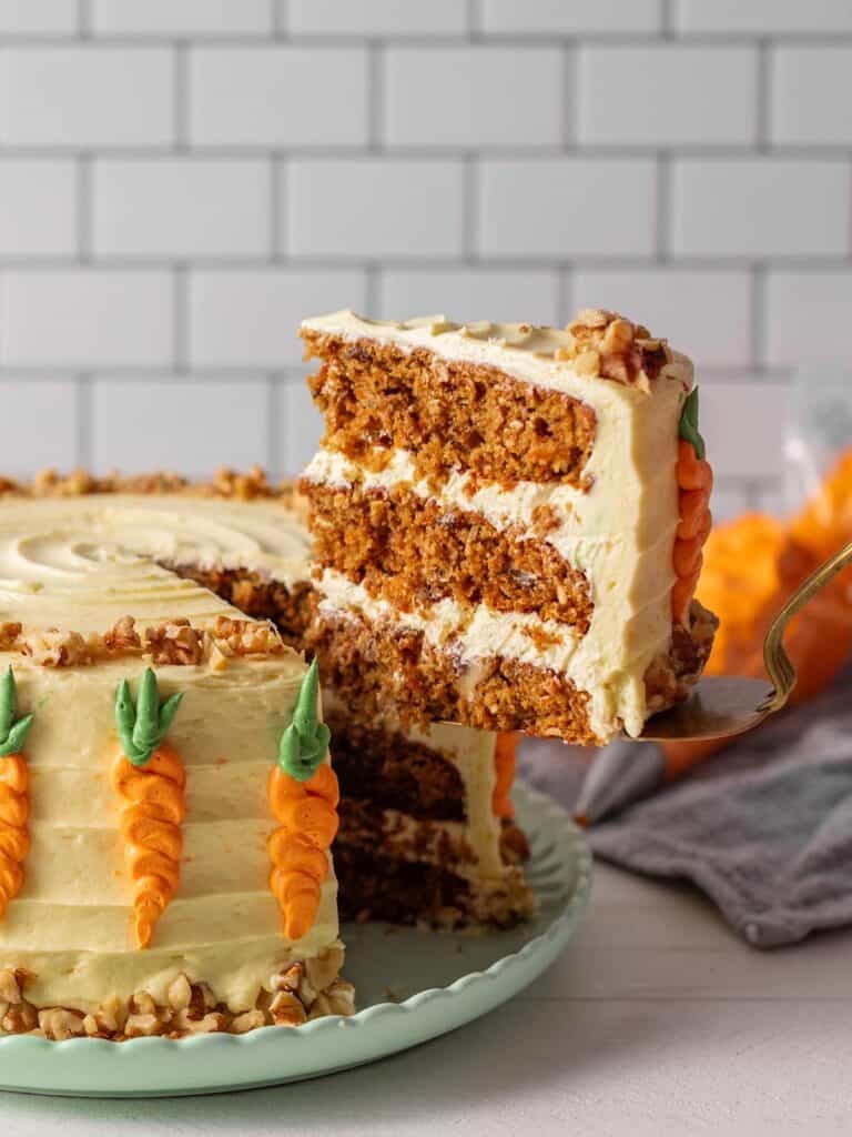 A slice being taken out of the full cake