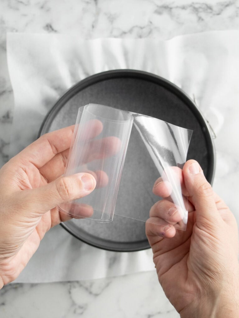 Hands holding the acetate to show what it looks like