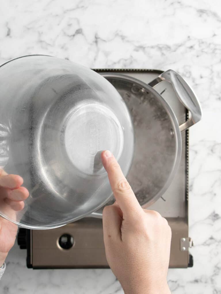 Making sure the bottom of the bowl doesn't touch the water