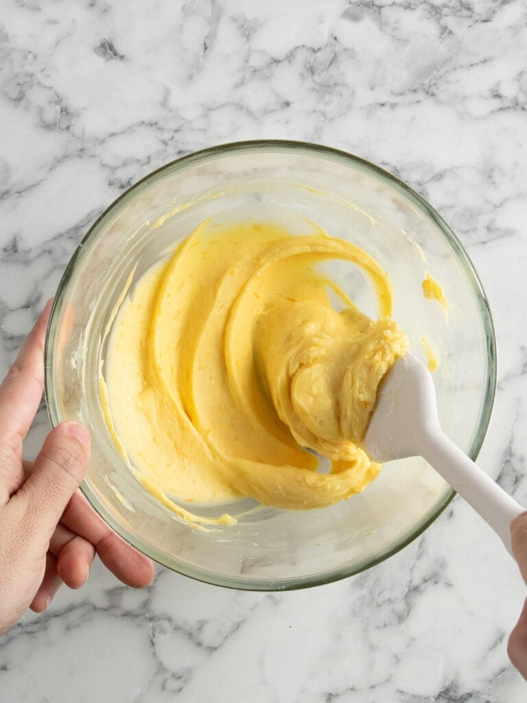 Combining the softened butter and sugar together using a spatula