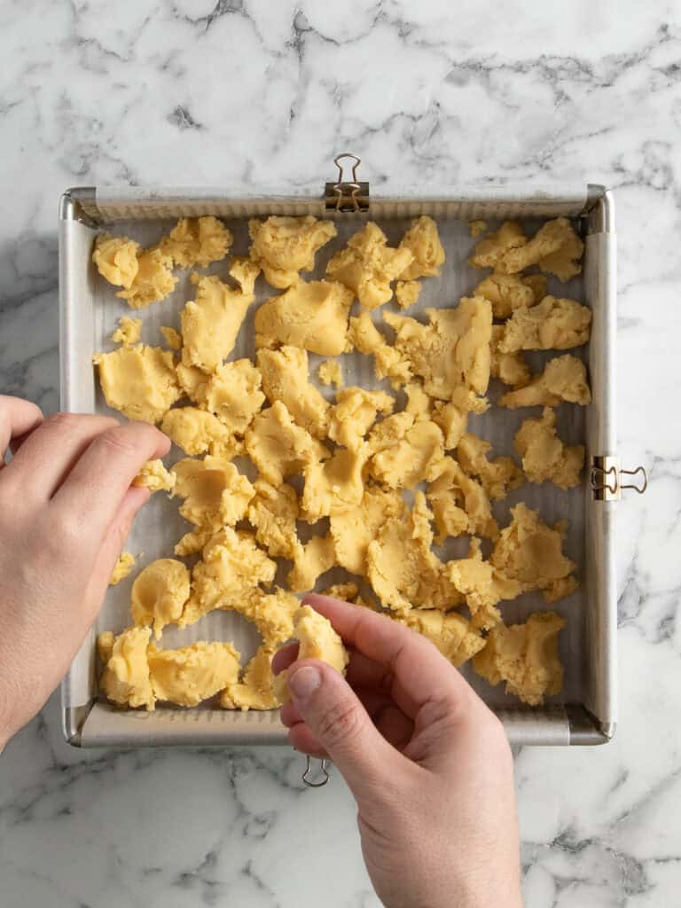 Distribute the dough into the baking tin
