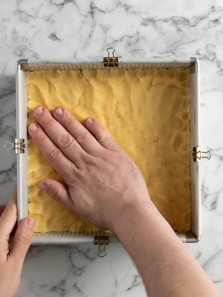 Press the dough into the baking tin