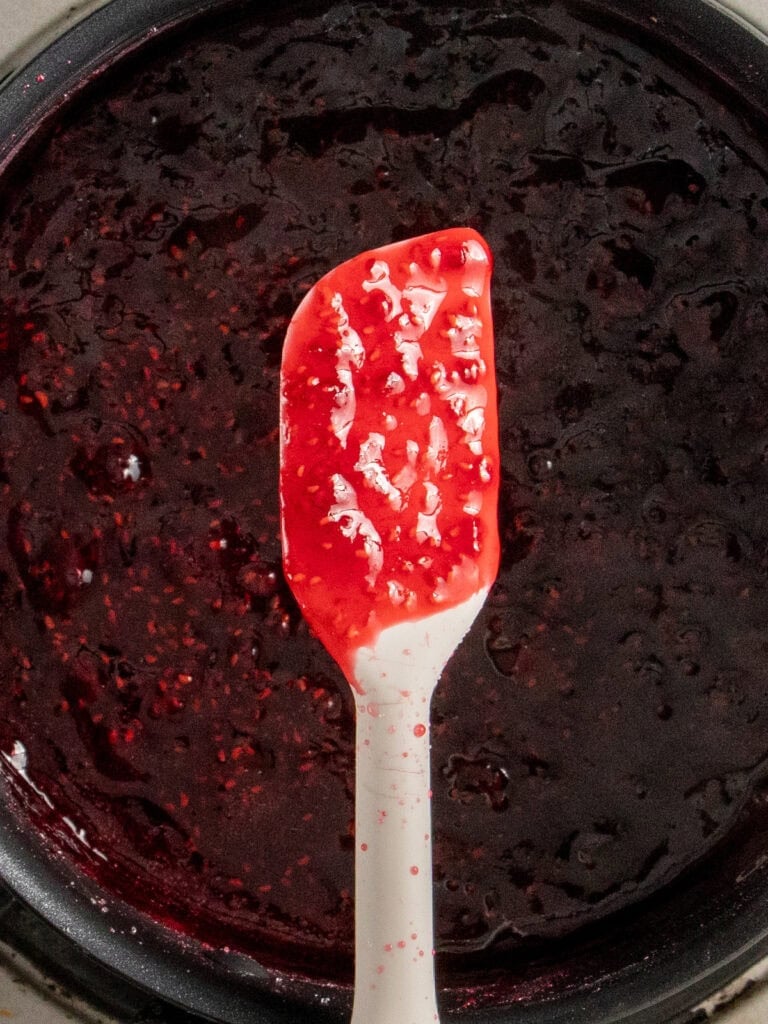 Showing how red the jam is on a spatula
