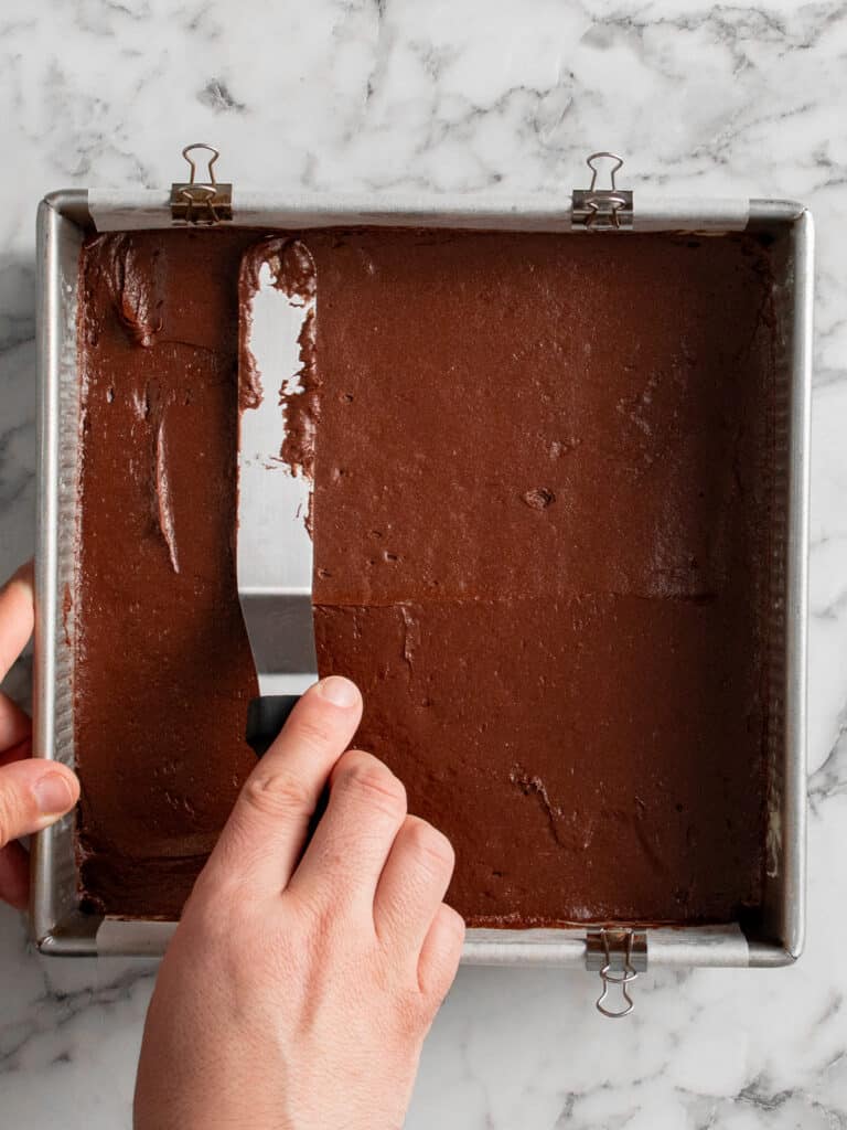 Spreading the batter into the baking tin