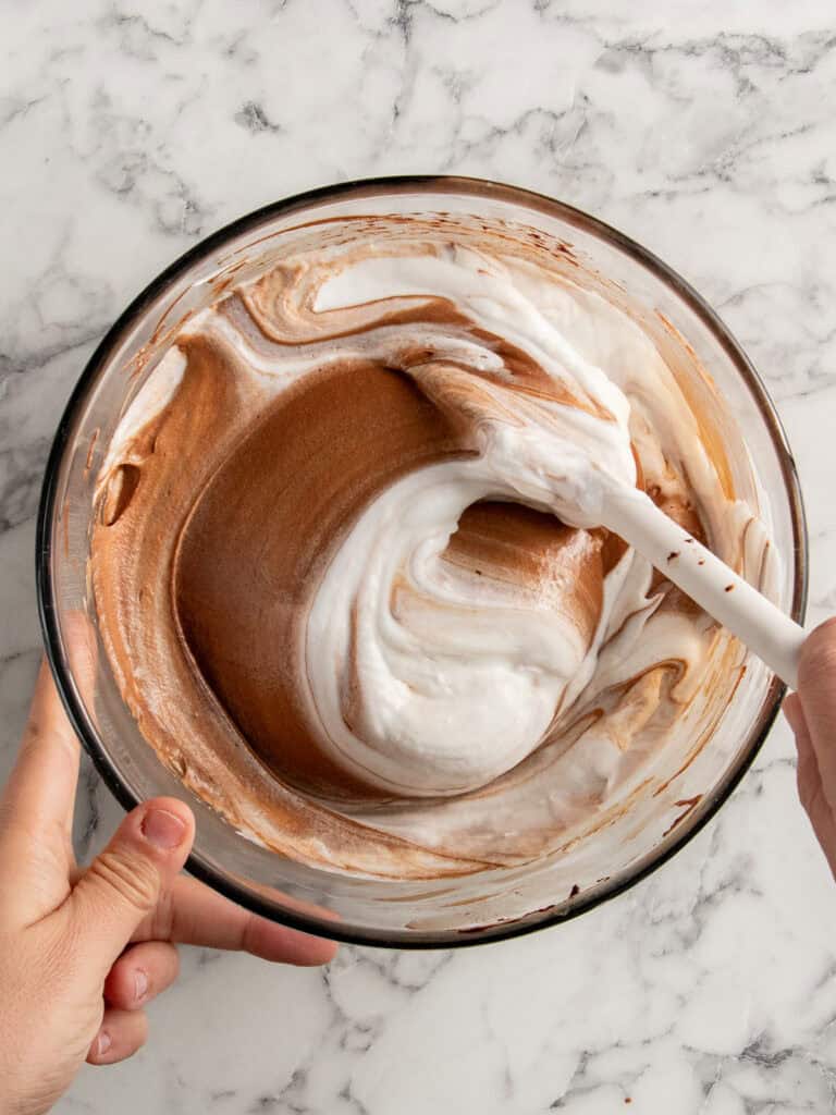 Folding the meringue into the chocolate mixture