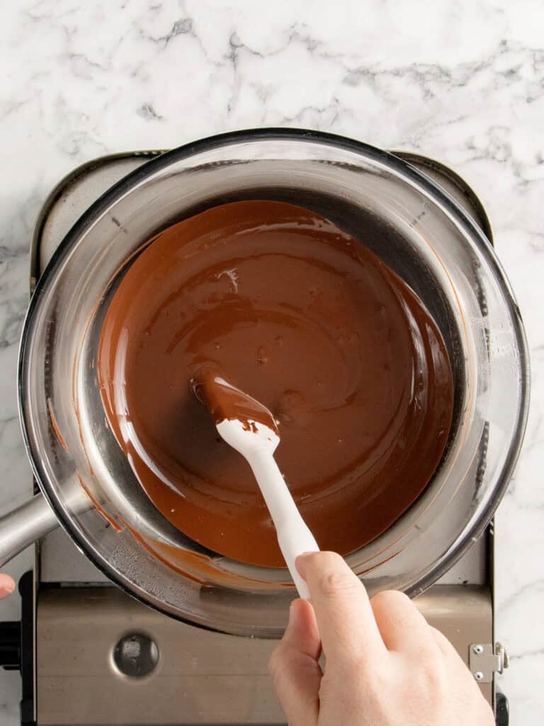 Melting the two chocolates over a double boiler