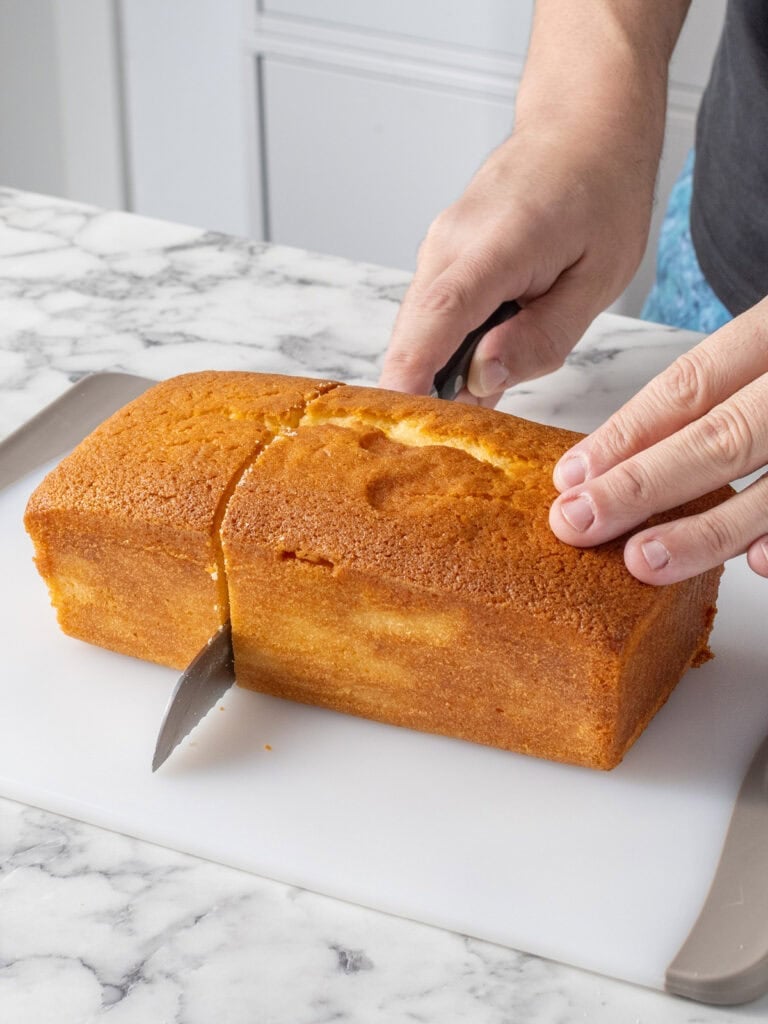 Slicing a third of the loaf cake away