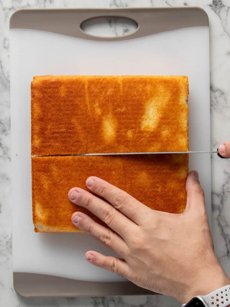 Slicing the square cake in half