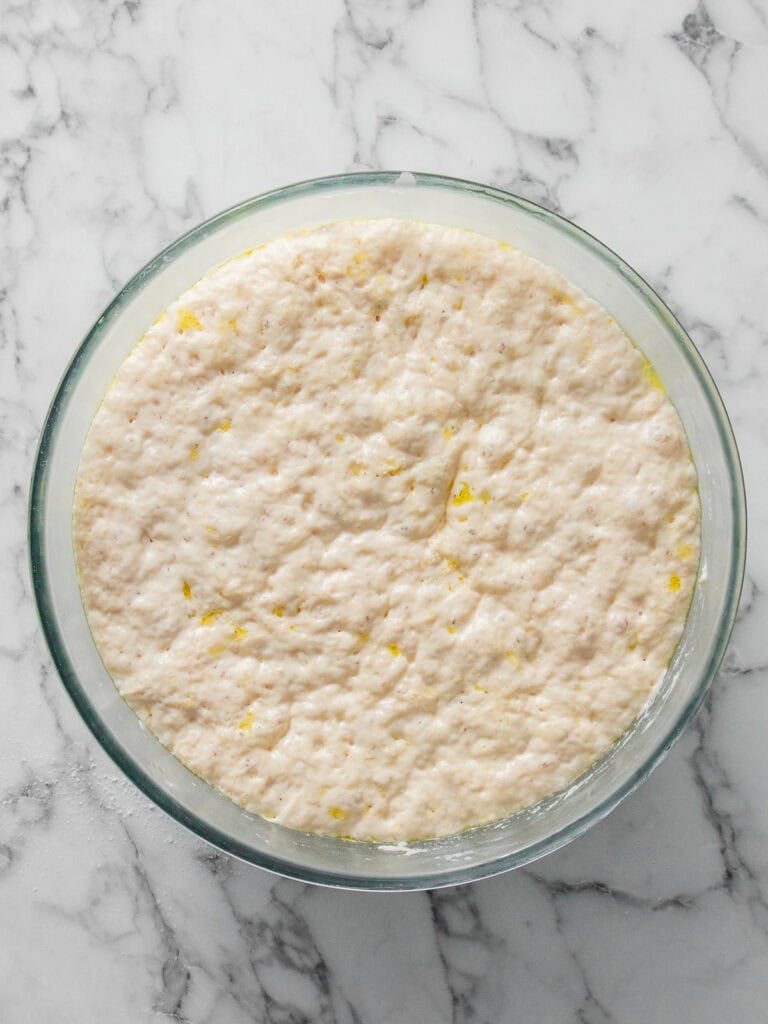 Showing how bubbly the dough looks after a 1 hour rise