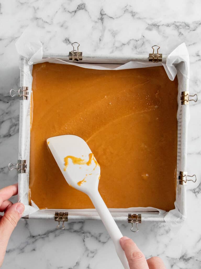 Spreading the caramel out before chilling to set