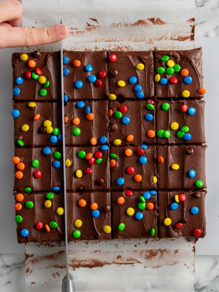 Slicing up the frosted brownies