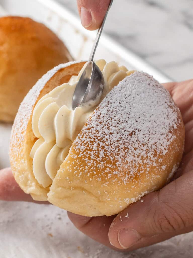 Creating an indent in the cream using a measuring spoon