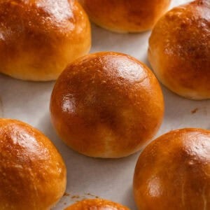 Square image of golden baked soft enriched French bread