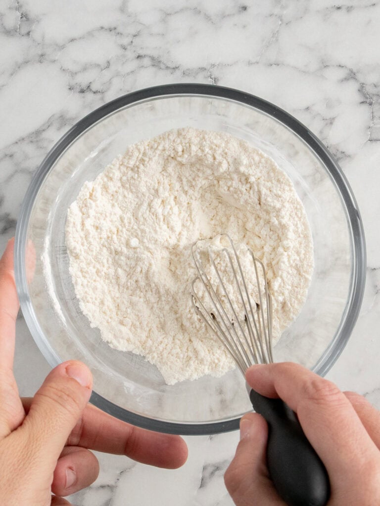 Using a whisk to combine the dry ingredients