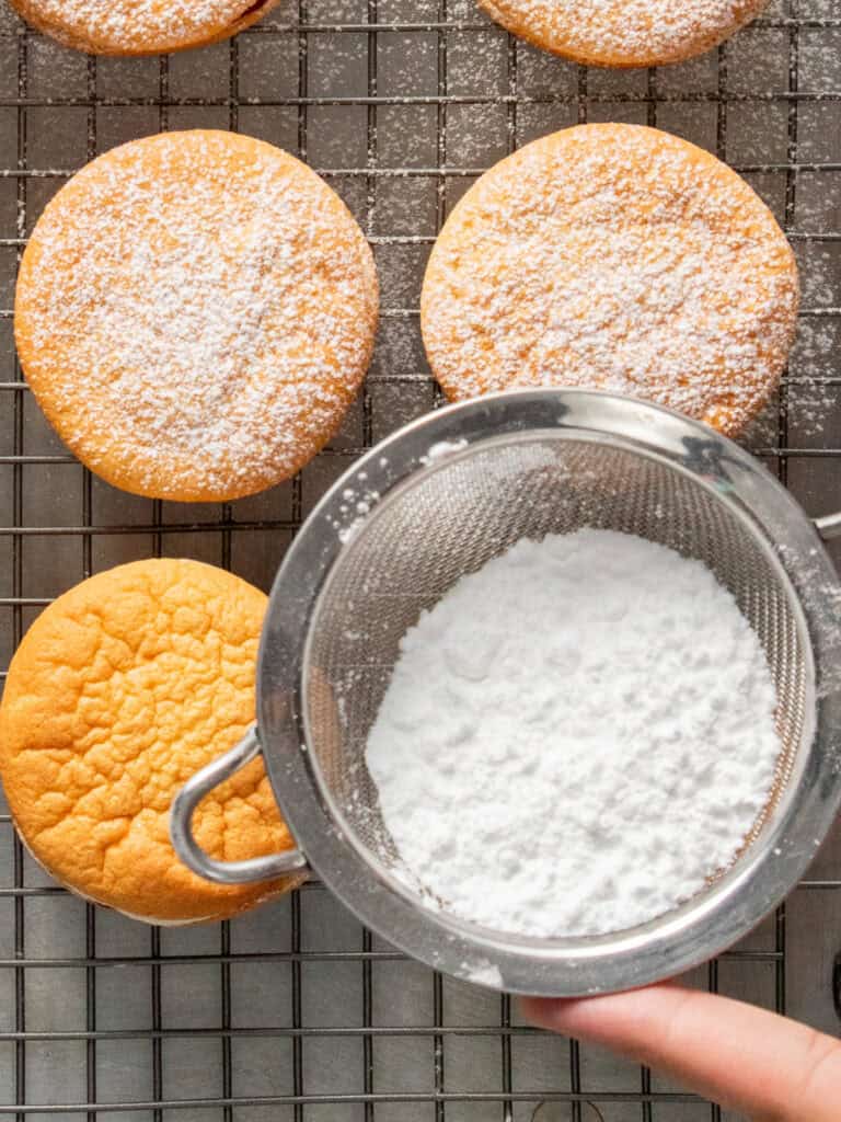 Dusting the top with powdered sugar