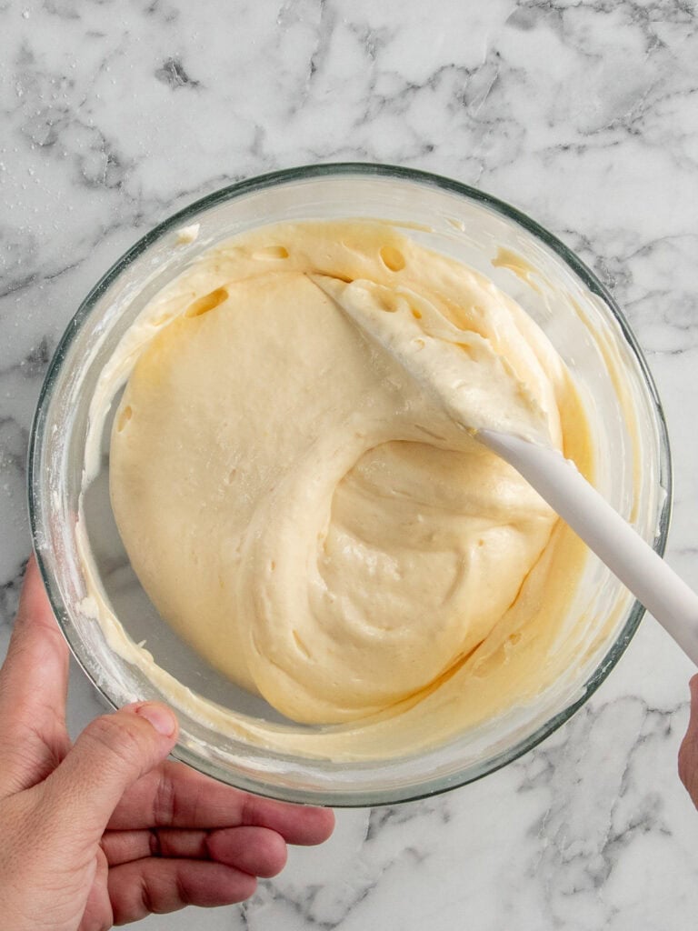Folding the dry ingredients through the egg mixture