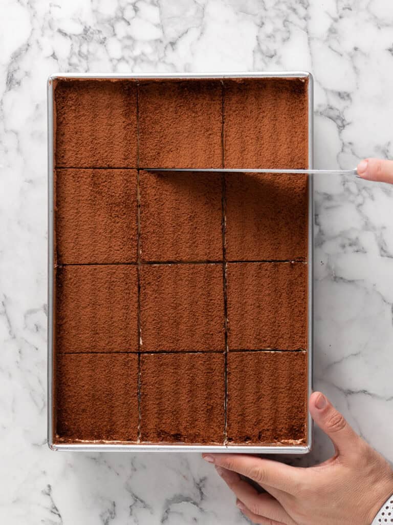 Use a large knife to slice the tiramisu