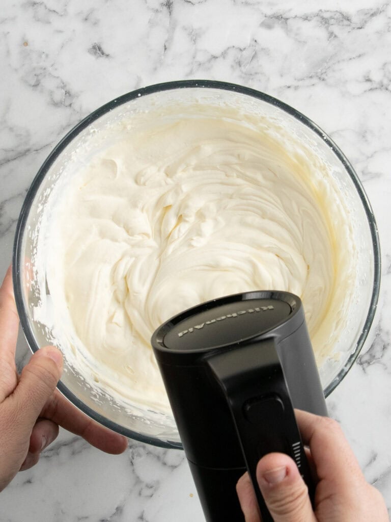 Whip the cold cream and mascarpone until you reach stiff peaks