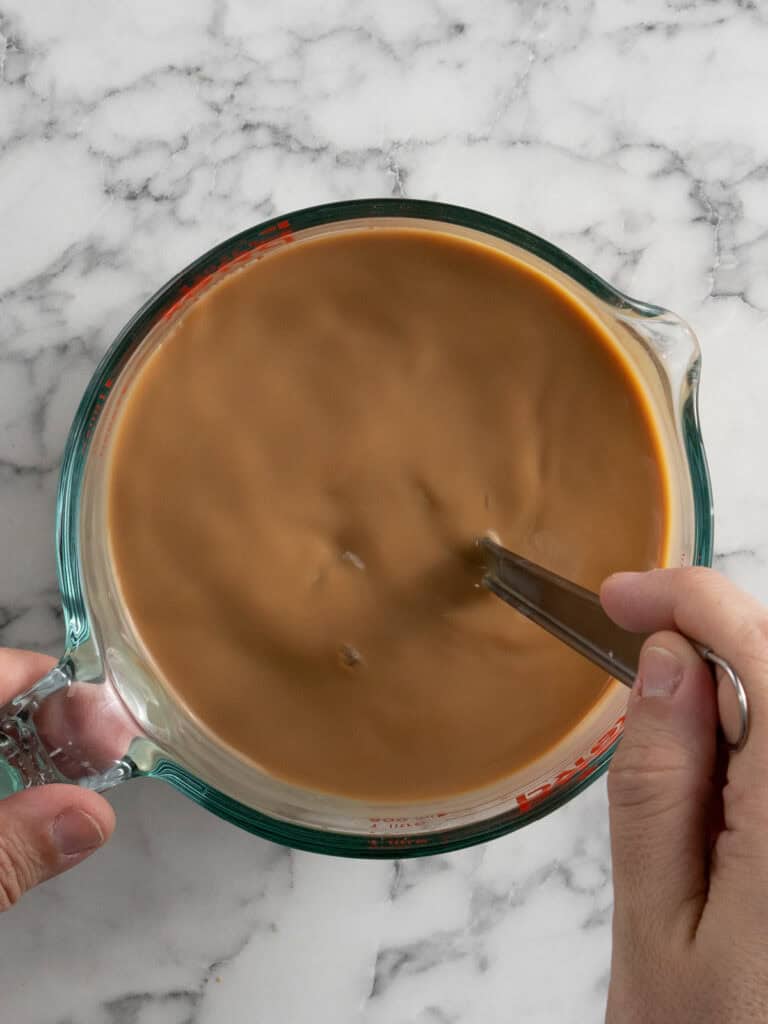 Milk the espresso with sugar and milk to create the syrup