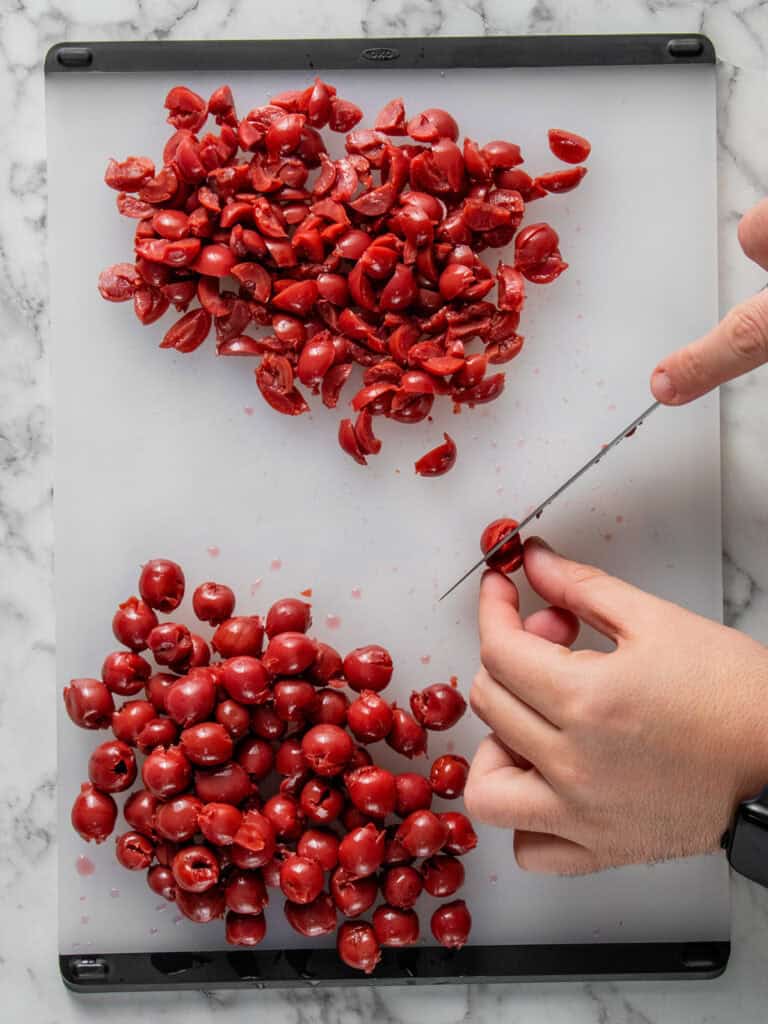 Chopping the jarred cherries
