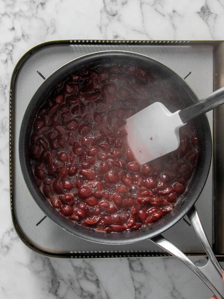 Cooking the cherries in sugar and brine