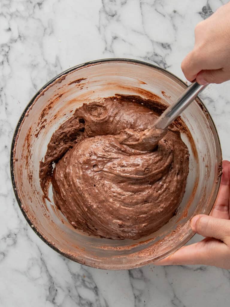 Adding the dry ingredients to the egg yolk mixture