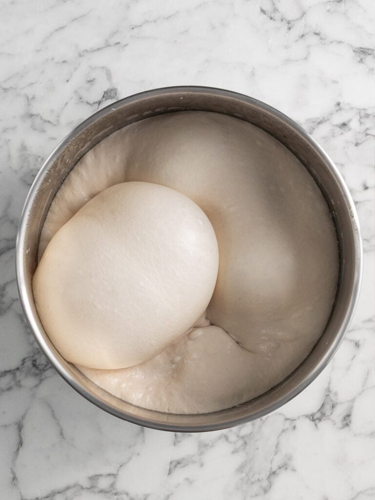 Showing what the dough looks like after a couple days of fermenting in the fridge
