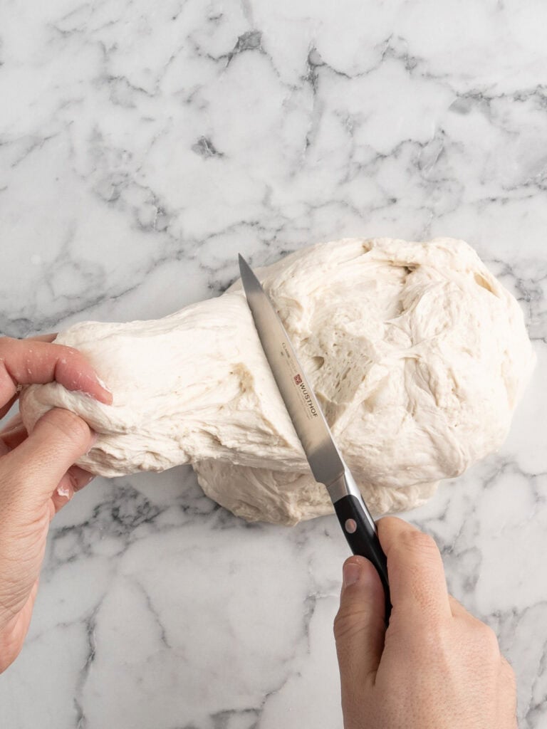 Portioning the dough with a knife