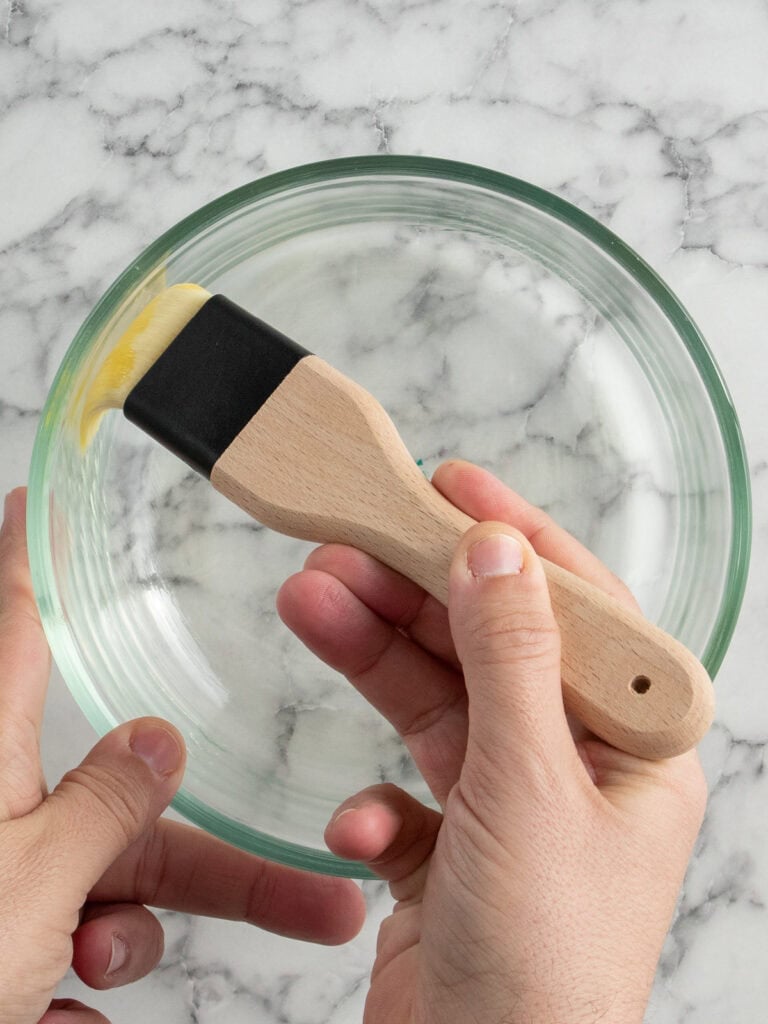 Brushing the oil around the glass bowl