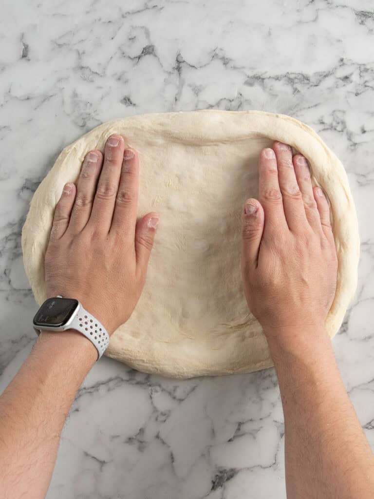 Stretching the dough outward