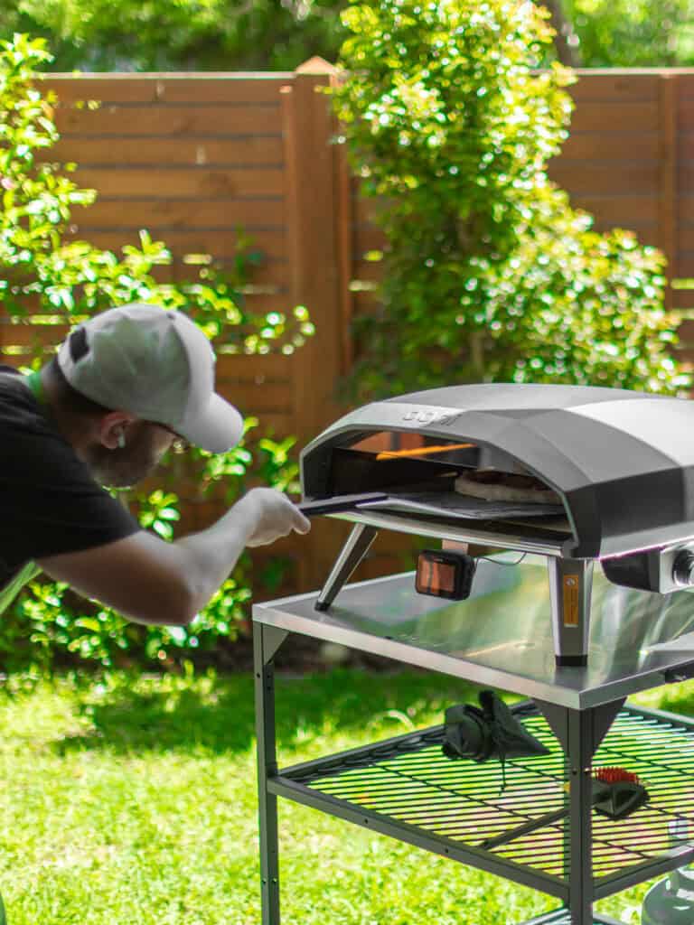 Using a pizza steel to turn the pizza around as it bakes